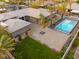 Expansive backyard featuring a sparkling pool, mature trees, and sleek modern design elements at 6110 Pebble Glen Ct, Las Vegas, NV 89149