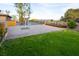 Well-maintained backyard with lush green grass, brick paving, and desert landscaping at 6110 Pebble Glen Ct, Las Vegas, NV 89149