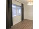 Bright bedroom featuring hardwood floors, recessed lighting, and natural light from windows with curtain rods at 6110 Pebble Glen Ct, Las Vegas, NV 89149