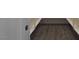 Walk-in closet with hardwood floors and open shelving, offering ample storage space at 6110 Pebble Glen Ct, Las Vegas, NV 89149