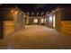 Charming courtyard featuring brick pavers and overhead string lights providing ambient lighting for outdoor gatherings at 6110 Pebble Glen Ct, Las Vegas, NV 89149