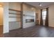 Modern fireplace and built-in shelving create a cozy focal point in the living space at 6110 Pebble Glen Ct, Las Vegas, NV 89149