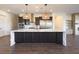 Modern kitchen featuring a marble island, stainless steel appliances, and stylish pendant lighting at 6110 Pebble Glen Ct, Las Vegas, NV 89149