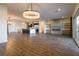Spacious living room showcasing an open floor plan and modern design with hardwood floors at 6110 Pebble Glen Ct, Las Vegas, NV 89149