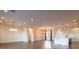 Open-concept living room and kitchen featuring hardwood floors and modern lighting fixtures at 6110 Pebble Glen Ct, Las Vegas, NV 89149