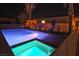 Backyard pool and jacuzzi with a spa, landscape lighting and mature landscaping, perfect for relaxation and entertaining at 6110 Pebble Glen Ct, Las Vegas, NV 89149