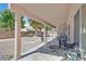 Covered patio with outdoor seating and grill, perfect for entertaining and enjoying the backyard at 6125 Desert Haven Rd, Las Vegas, NV 89130