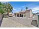 A spacious gravel backyard with a covered patio, desert landscaping and block wall offer privacy at 6125 Desert Haven Rd, Las Vegas, NV 89130