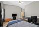 Well-lit bedroom includes a ceiling fan, large window, and a comfortable bed at 6125 Desert Haven Rd, Las Vegas, NV 89130
