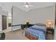 Spacious bedroom with vaulted ceiling, ceiling fan, and desk area at 6125 Desert Haven Rd, Las Vegas, NV 89130