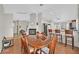 Dining room with hardwood floors near kitchen and fireplace at 6125 Desert Haven Rd, Las Vegas, NV 89130