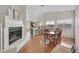 Dining room with hardwood floors adjacent to the kitchen and fireplace at 6125 Desert Haven Rd, Las Vegas, NV 89130