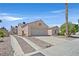 A delightful single-story home featuring a two car garage and gated driveway with concrete runners at 6125 Desert Haven Rd, Las Vegas, NV 89130