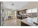 Modern kitchen with stainless steel appliances, granite counters, and tile floors at 6125 Desert Haven Rd, Las Vegas, NV 89130