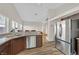 Kitchen featuring stainless appliances, granite countertops, and tile flooring at 6125 Desert Haven Rd, Las Vegas, NV 89130