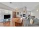 Bright living room with hardwood floors, fireplace and view of dining area at 6125 Desert Haven Rd, Las Vegas, NV 89130