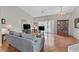 Spacious living room with hardwood floors, vaulted ceiling and natural light throughout at 6125 Desert Haven Rd, Las Vegas, NV 89130