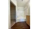 Bathroom with tub, wood-look floors, and window at 6316 Beige Bluff St # 201, North Las Vegas, NV 89081