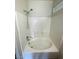Relaxing bathroom featuring a soaking tub with a shower head and tiled walls at 6316 Beige Bluff St # 201, North Las Vegas, NV 89081