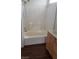 Bathroom with tub and shower area, and wood look floor at 6316 Beige Bluff St # 201, North Las Vegas, NV 89081