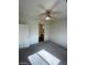 Cozy bedroom featuring carpet, ceiling fan, ensuite bathroom, and a walk in closet at 6316 Beige Bluff St # 201, North Las Vegas, NV 89081