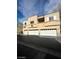 Well-maintained apartment building with multiple garages and neutral-toned exterior at 6316 Beige Bluff St # 201, North Las Vegas, NV 89081