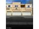 Building exterior showcasing multiple units and garages enhancing community living at 6316 Beige Bluff St # 201, North Las Vegas, NV 89081
