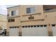 Charming apartment complex featuring a clean facade, private garages, and well-lit entryways at 6316 Beige Bluff St # 201, North Las Vegas, NV 89081