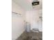 Clean garage interior featuring a water heater, storage shelves, and a service door at 6316 Beige Bluff St # 201, North Las Vegas, NV 89081