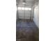 Spacious garage with a multi-panel door and overhead lighting, ready for parking or storage at 6316 Beige Bluff St # 201, North Las Vegas, NV 89081