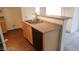 Kitchen with sink, wood-look floors and a dishwasher at 6316 Beige Bluff St # 201, North Las Vegas, NV 89081