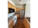 Modern kitchen with stainless steel refrigerator and plenty of counter space at 6316 Beige Bluff St # 201, North Las Vegas, NV 89081