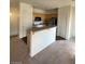 Open kitchen with modern stainless-steel appliances and light wood cabinetry at 6316 Beige Bluff St # 201, North Las Vegas, NV 89081
