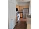 Efficient kitchen featuring plenty of cabinets, wood floors and modern track lighting at 6316 Beige Bluff St # 201, North Las Vegas, NV 89081