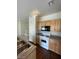 Efficient kitchen featuring plenty of cabinets, wood floors and modern track lighting at 6316 Beige Bluff St # 201, North Las Vegas, NV 89081