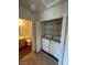 Convenient laundry area featuring a washer and dryer, with access to a bathroom at 6316 Beige Bluff St # 201, North Las Vegas, NV 89081
