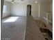 Spacious living room features carpet, ceiling fan, and a bright, airy atmosphere at 6316 Beige Bluff St # 201, North Las Vegas, NV 89081