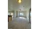Spacious living room with carpet, ceiling fan, and a view to the outdoor patio at 6316 Beige Bluff St # 201, North Las Vegas, NV 89081
