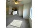 Spacious living room featuring neutral carpet, abundant natural light, and an open floor plan at 6316 Beige Bluff St # 201, North Las Vegas, NV 89081