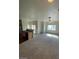 Living space open to kitchen featuring stainless appliances, breakfast bar, and natural light for a modern feel at 6316 Beige Bluff St # 201, North Las Vegas, NV 89081