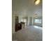 Open living area flows into kitchen, offering ample space and natural light creating a welcoming ambiance at 6316 Beige Bluff St # 201, North Las Vegas, NV 89081