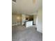 Open living space and kitchen offering carpeted floors and natural light at 6316 Beige Bluff St # 201, North Las Vegas, NV 89081