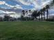 Scenic park area with lush green grass, walking path, and playground equipment at 6316 Beige Bluff St # 201, North Las Vegas, NV 89081