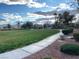 Scenic park area with lush green grass, walking path, and playground equipment at 6316 Beige Bluff St # 201, North Las Vegas, NV 89081