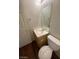 Cozy powder room features a wood vanity with laminate countertop and decorative mirror at 6316 Beige Bluff St # 201, North Las Vegas, NV 89081