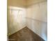 Spacious walk-in closet with metal shelving for ample storage and neutral carpet at 6316 Beige Bluff St # 201, North Las Vegas, NV 89081