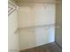 White spacious walk-in closet featuring metal shelving and carpet at 6316 Beige Bluff St # 201, North Las Vegas, NV 89081