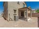 Backyard showing a covered patio with a concrete slab and a sliding door to the home's interior at 6443 Burlap Ct, Las Vegas, NV 89122