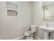 Bathroom with pedestal sink and toilet at 6443 Burlap Ct, Las Vegas, NV 89122