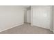 Light-filled bedroom featuring neutral walls, carpet flooring and a closet at 6443 Burlap Ct, Las Vegas, NV 89122